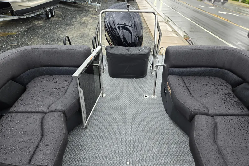 Slide: The Image of Wet deck of 2026 Evotti 721QL boat with cushioned seating and railing. - 20