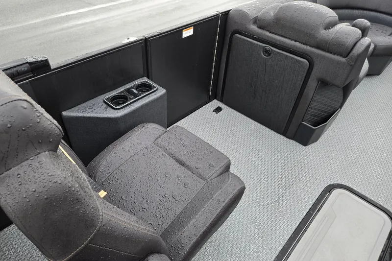 Slide: The Image of Interior of 2026 Evotti 721QL boat with wet seating and cup holders. - 32