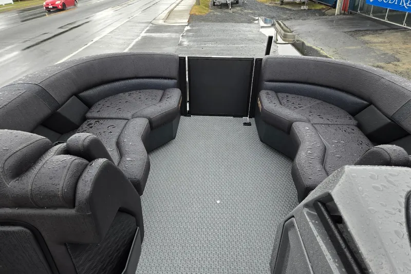 Slide: The Image of Luxurious 2026 Evotti 721QL boat interior with sleek, rain-dappled seating on a wet day. - 33