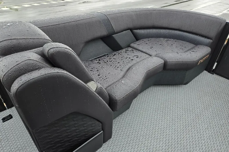 Slide: The Image of Wet seating area on 2026 Evotti 721QL boat, featuring sleek, dark upholstery. - 35