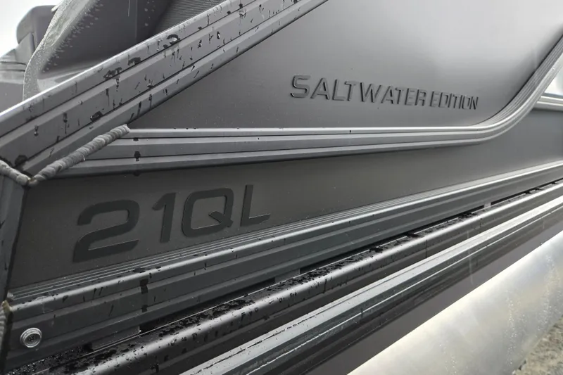 Slide: The Image of Close-up of Evotti 721QL Saltwater Edition boat, showcasing sleek design and branding. - 37
