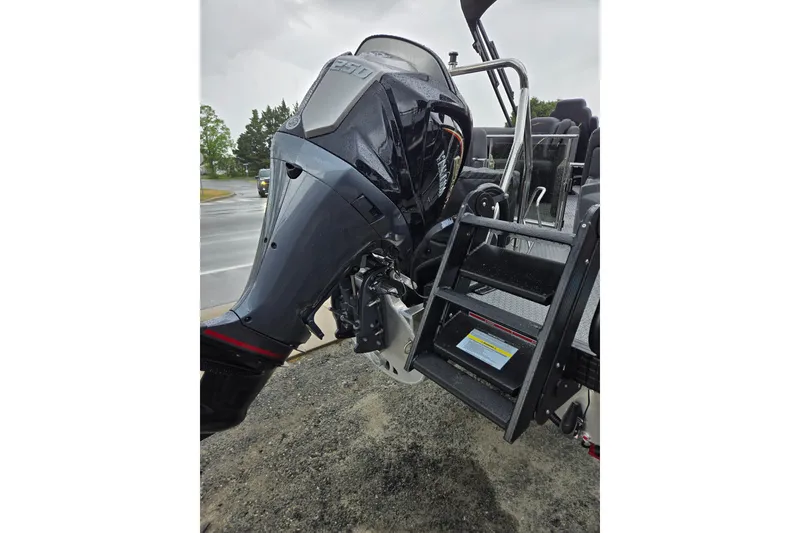 Slide: The Image of Evotti 721QL 2026 boat engine with ladder, parked on a wet road. - 39