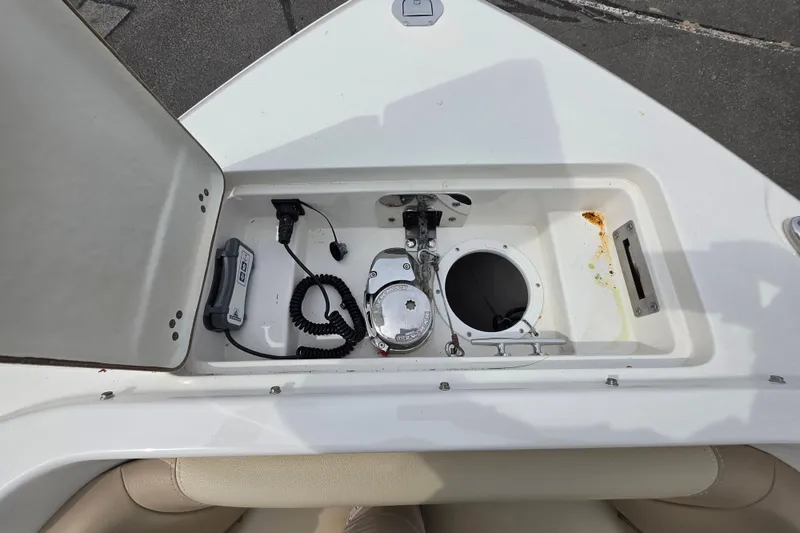 Slide: The Image of 2019 Sailfish 275 DC boat compartment with equipment and storage space. - 15