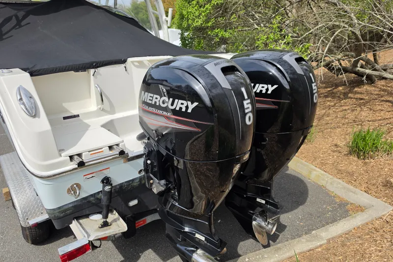 Slide: The Image of 2019 Sailfish 275 DC boat with twin Mercury 150 FourStroke outboard engines. - 2