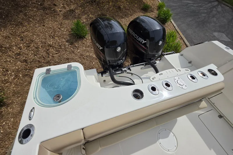 Slide: The Image of 2019 Sailfish 275 DC boat with dual Mercury engines and fishing rod holders. - 3