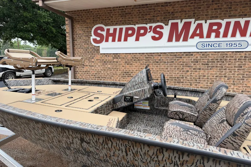 Slide: The Image of 2026 Xpress H18C Crappie boat at Shipp's Marina, featuring camo design and fishing seats. - 4