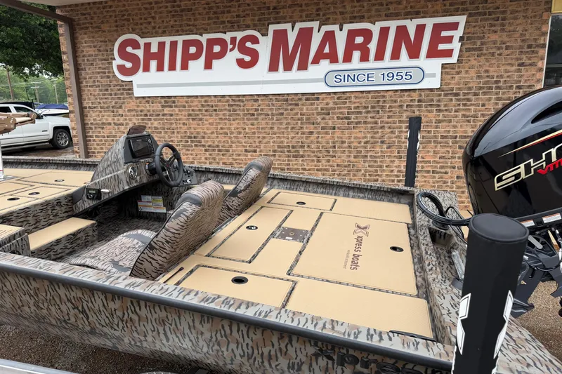 Slide: The Image of 2026 Xpress H18C Crappie boat at Shipp's Marine, featuring camo design and modern controls. - 5