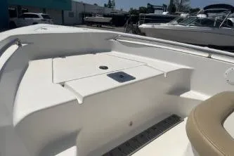 Slide: The Image of 2014 Key West 189 FS boat interior with seating and storage compartments. - 10