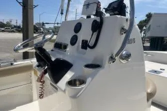 Slide: The Image of 2014 Key West 189 FS boat console with steering wheel and controls. - 13