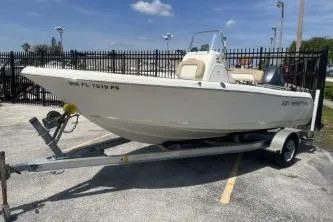 Slide: The Image of 2014 Key West 189 FS boat on trailer in parking lot. - 4
