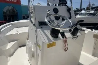 Slide: The Image of 2014 Key West 189 FS boat console with steering wheel and controls. - 9