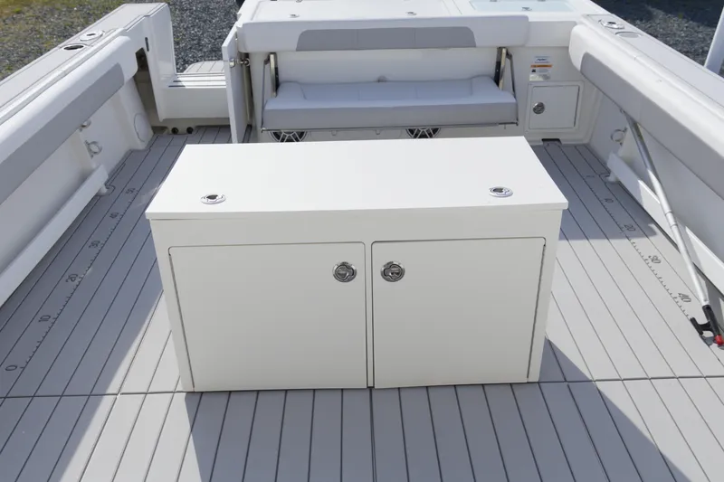 Slide: The Image of 2020 Parker 2810 XLD Walkaround boat deck with storage cabinet and seating area. - 10