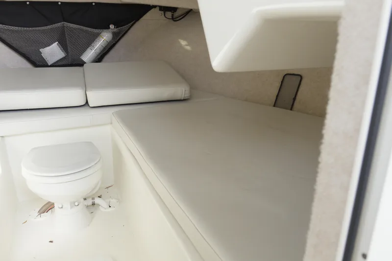 Slide: The Image of 2020 Parker 2810 XLD Walkaround cabin interior with toilet and cushioned seating. - 18