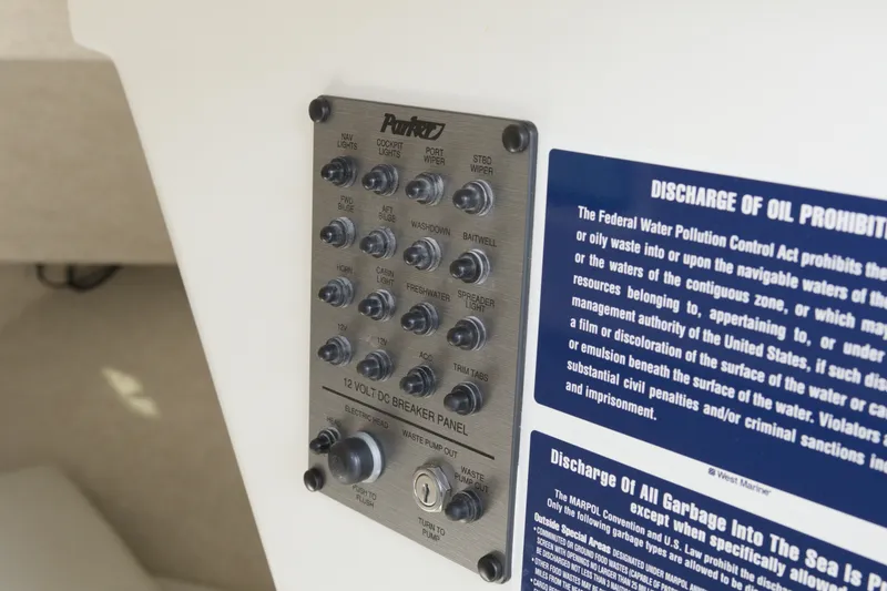 Slide: The Image of Control panel on a 2020 Parker 2810 XLD Walkaround boat with safety notices. - 19