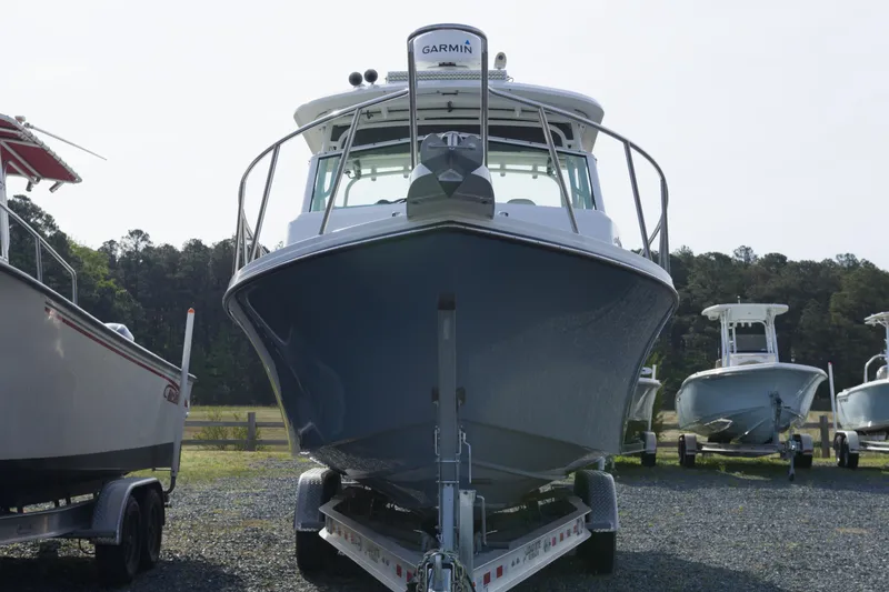 Slide: The Image of 2020 Parker 2810 XLD Walkaround boat on trailer, front view, outdoors. - 2