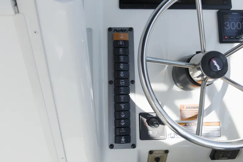 Slide: The Image of Control panel and steering wheel of a 2020 Parker 2810 XLD Walkaround boat. - 25