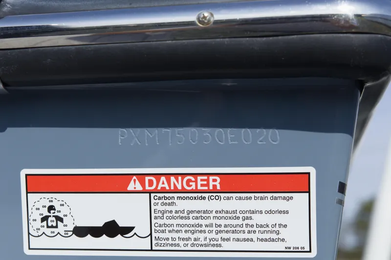 Slide: The Image of Danger warning label on 2020 Parker 2810 XLD Walkaround boat, cautioning about carbon monoxide risks. - 33