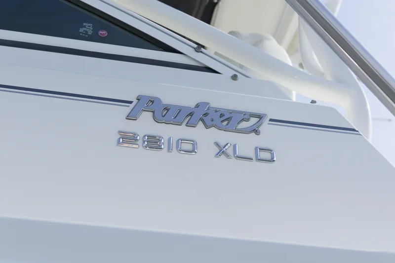 Slide: The Image of 2020 Parker 2810 XLD Walkaround boat logo on white hull. - 7