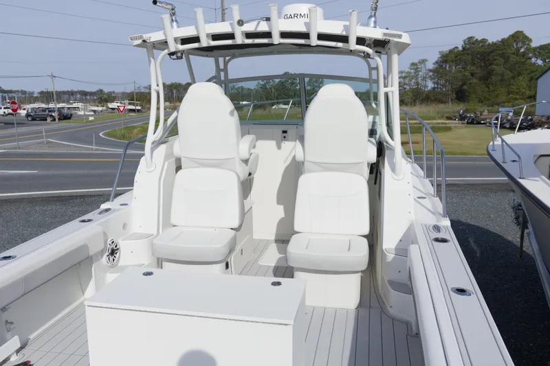 Slide: The Image of 2020 Parker 2810 XLD Walkaround boat interior with seating and helm station. - 8