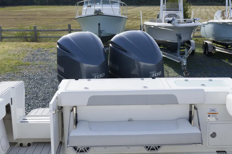 Slide: The Image of 2020 Parker 2810 XLD Walkaround with twin Yamaha 300 engines, docked outdoors. - 9