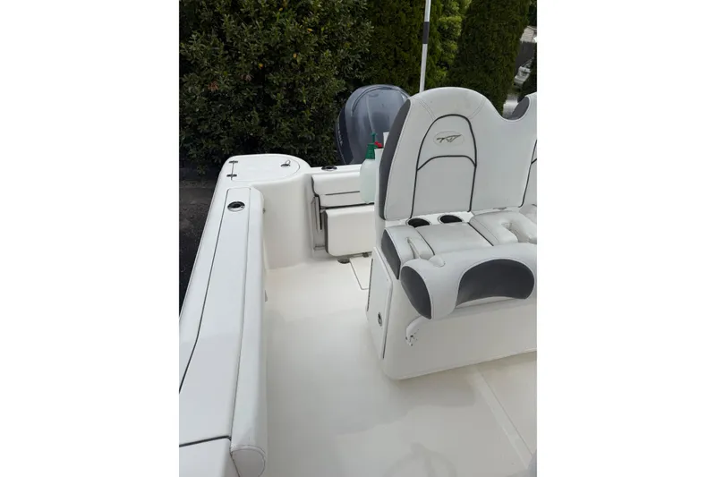 Slide: The Image of 2015 Tidewater 232 CC Adventure boat interior with seating and console. - 7