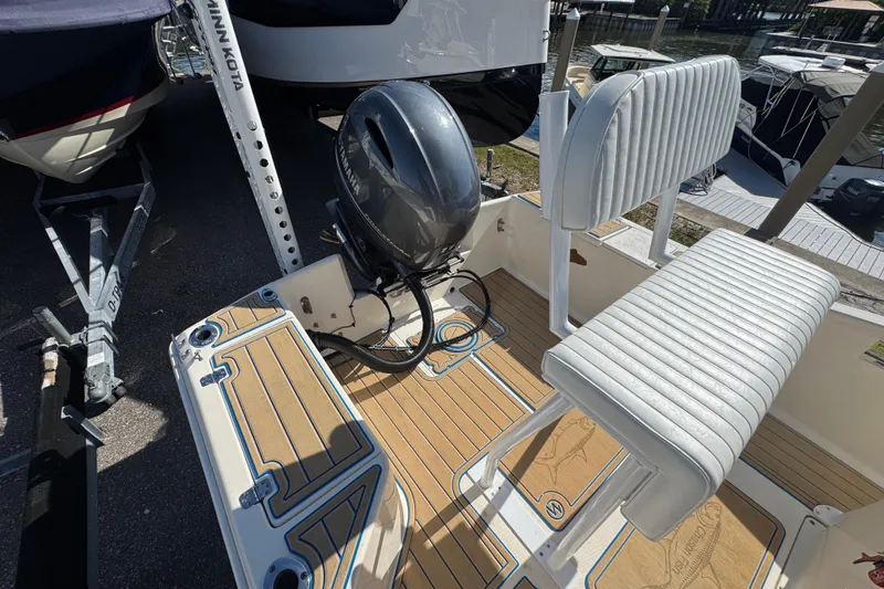 Slide: The Image of 2005 Scout 175 Sportfish boat with Yamaha outboard motor and cushioned seating. - 12