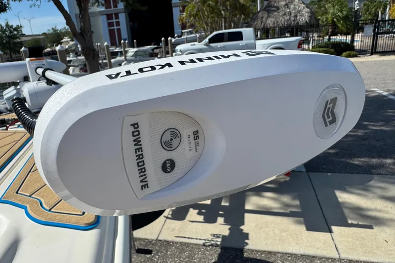 Slide: The Image of Minn Kota PowerDrive motor on 2005 Scout 175 Sportfish boat, parked outdoors. - 7