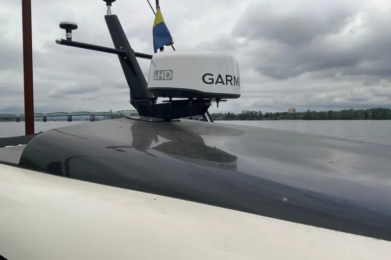 Slide: The Image of 2004 Rivolta PT Runner 4.0 boat with Garmin radar on a cloudy day. - 13