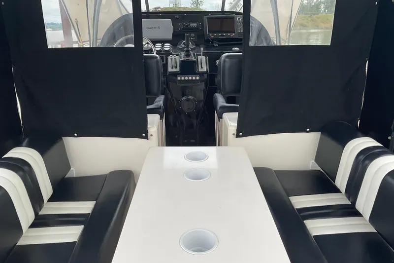 Slide: The Image of Interior of 2004 Rivolta PT Runner 4.0 boat with seating and navigation equipment. - 15