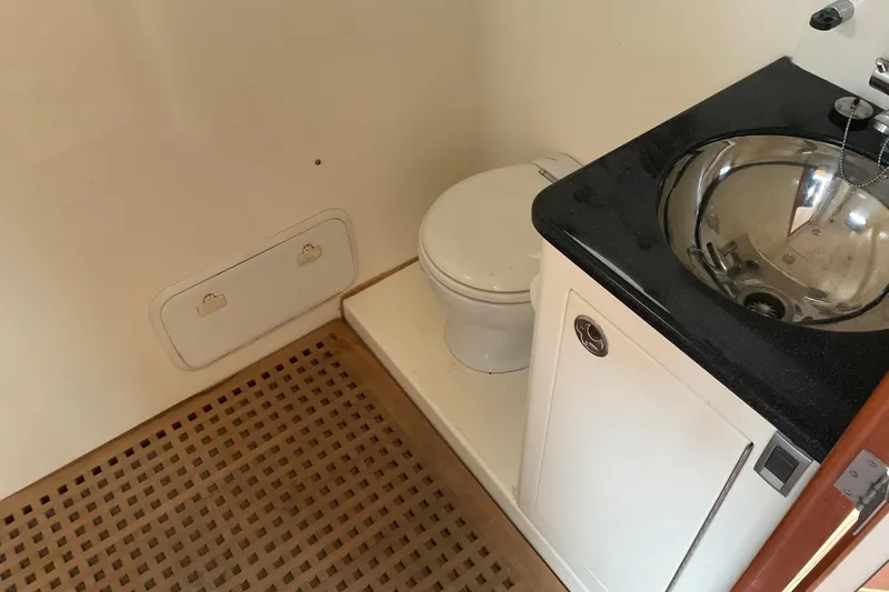 Slide: The Image of Bathroom interior of 2004 Rivolta PT Runner 4.0 with sink and toilet. - 27