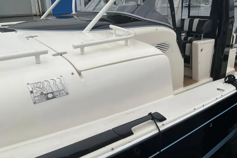 Slide: The Image of 2004 Rivolta PT Runner 4.0 boat, featuring sleek design and comfortable seating. - 7