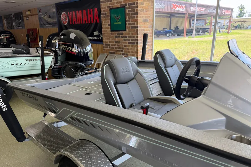 Slide: The Image of 2026 Xpress H17 boat interior with Yamaha engine, showroom display. - 2
