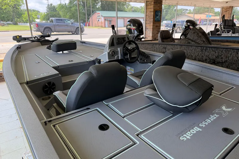 Slide: The Image of 2026 Xpress H17 boat interior with modern seating and steering console. - 3