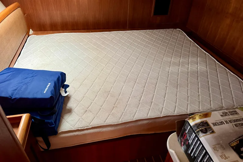Slide: The Image of Interior cabin of 2007 Hunter 41 Deck Salon with bed and blue bag. - 14