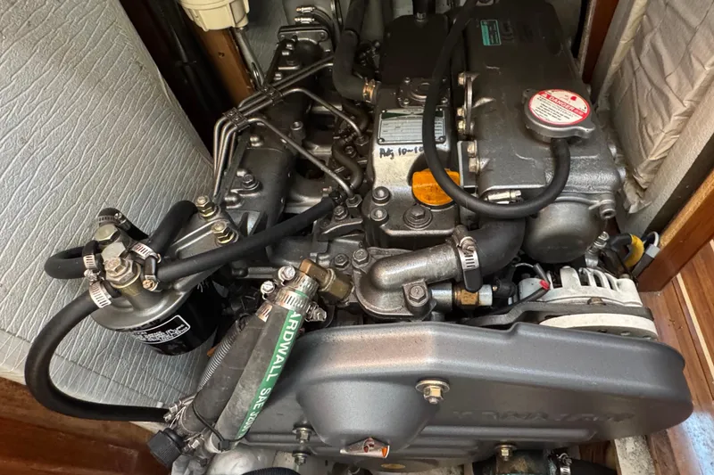 Slide: The Image of Engine of 2007 Hunter 41 Deck Salon sailboat, showcasing detailed mechanical components. - 23