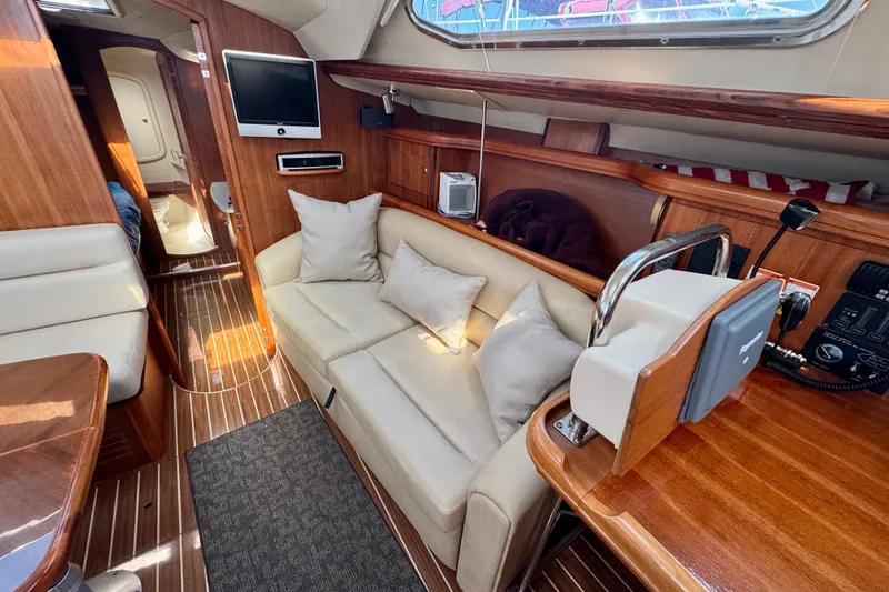 Slide: The Image of Interior of 2007 Hunter 41 Deck Salon yacht with cozy seating and modern amenities. - 4