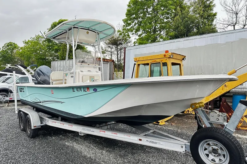 The Image of 2017 Carolina Skiff 238DLV boat on trailer, parked outdoors. - 0