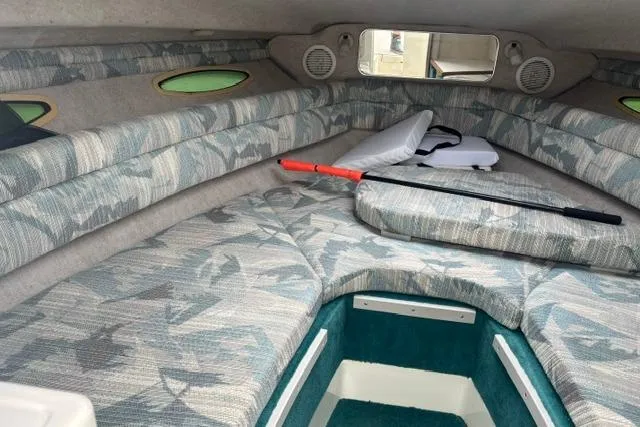 Slide: The Image of Interior cabin of a 1994 Sea Ray 240 boat with patterned upholstery. - 17
