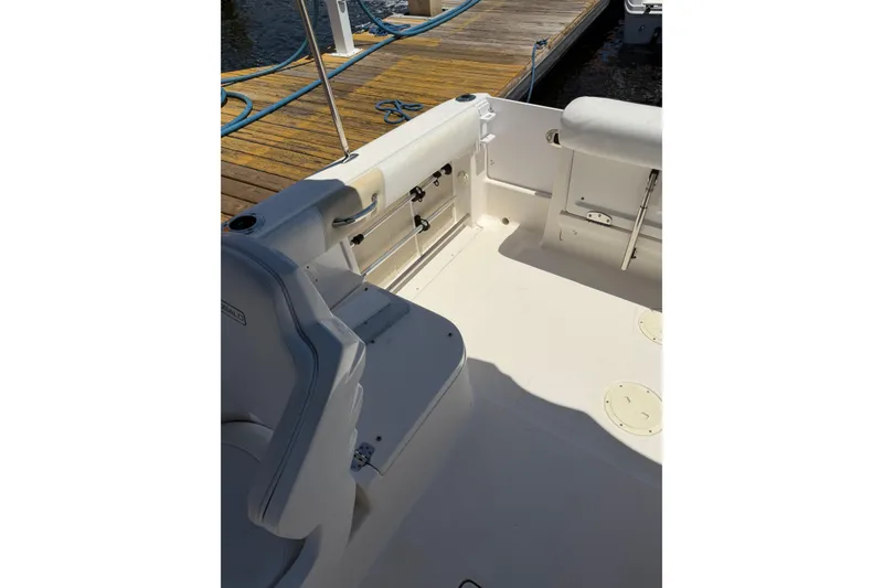 Slide: The Image of 2015 Robalo R227 Dual Console boat interior with seating and deck details. - 7