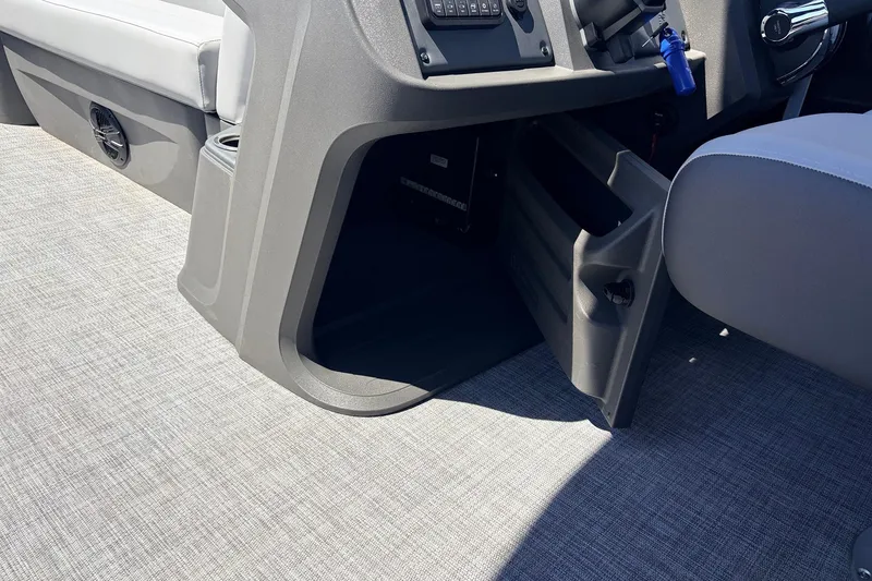 Slide: The Image of Interior of 2026 Sun Tracker Party Barge 22 DLX, featuring seating and console details. - 35