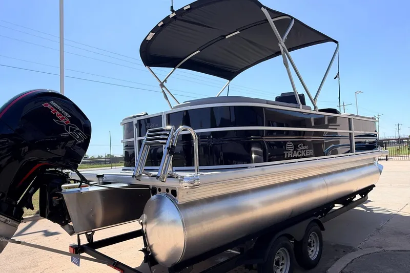 Slide: The Image of 2026 Sun Tracker Party Barge 22 DLX pontoon boat with Mercury engine on trailer. - 6