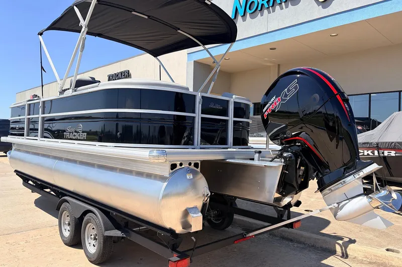 Slide: The Image of 2026 Sun Tracker Party Barge 22 DLX pontoon boat with Mercury engine on trailer. - 8
