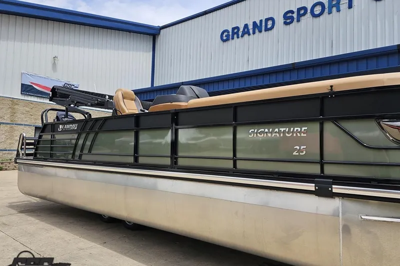 Slide: The Image of 2026 Landau Signature 25C pontoon boat displayed at Grand Sport facility. - 11