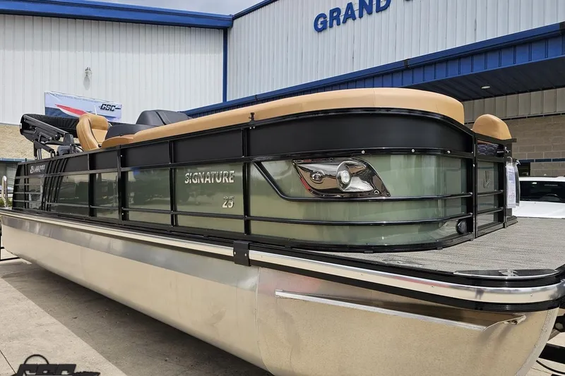Slide: The Image of 2026 Landau Signature 25C pontoon boat displayed at dealership. - 12