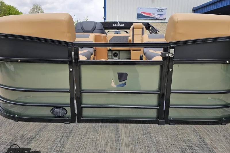 Slide: The Image of 2026 Landau Signature 25C pontoon boat with tan seating and sleek design. - 16