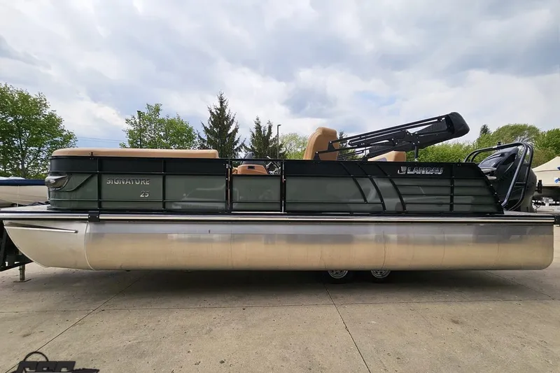 Slide: The Image of 2026 Landau Signature 25C pontoon boat on display, featuring sleek design and modern amenities. - 25