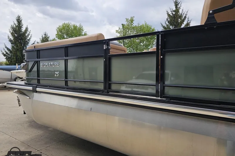 Slide: The Image of 2026 Landau Signature 25C pontoon boat with sleek design and comfortable seating. - 27
