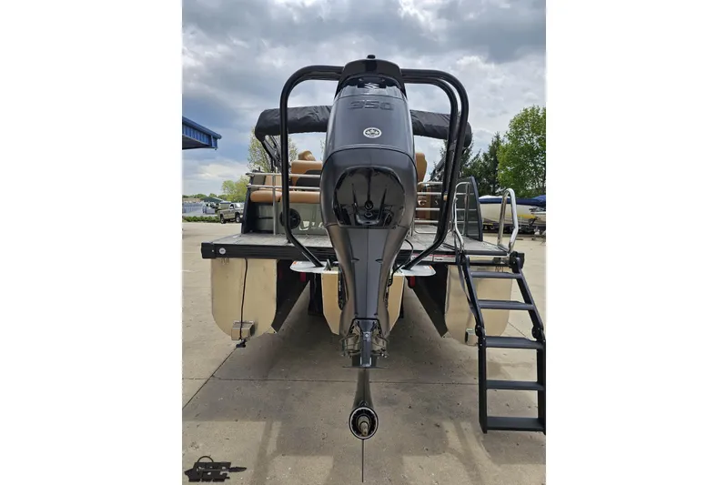 Slide: The Image of 2026 Landau Signature 25C pontoon boat with powerful outboard motor and rear ladder. - 33