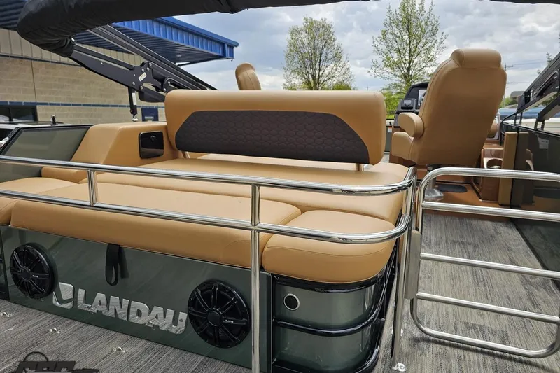 Slide: The Image of 2026 Landau Signature 25C pontoon boat with tan seating and sleek metal railings. - 38