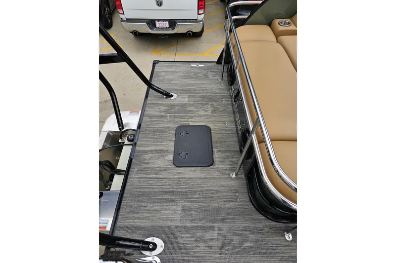 Slide: The Image of 2026 Landau Signature 25C pontoon boat deck with tan seating and metal railings. - 40